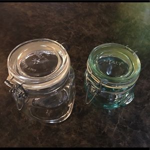 2 Glass storage jars with metal closures. Italy